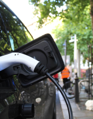 How can Electric Vehicles help save on parking?